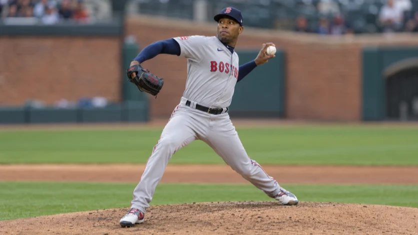 Aroldis Chapman pitching in a Boston Red Sox uniform.